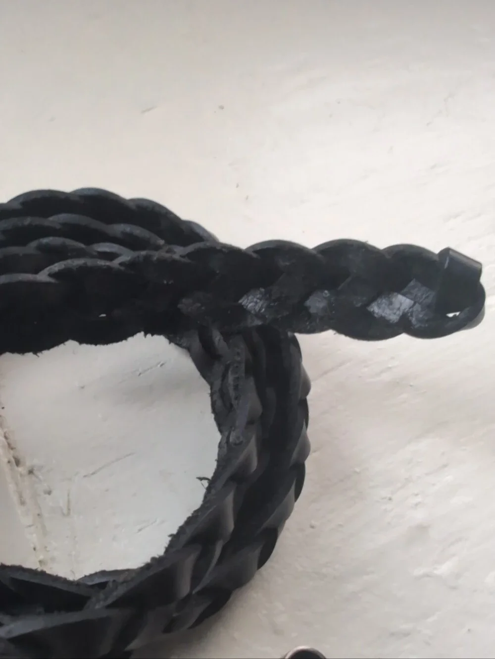 Black real leather fully adjustable braided skinny belt with silver tone buckle